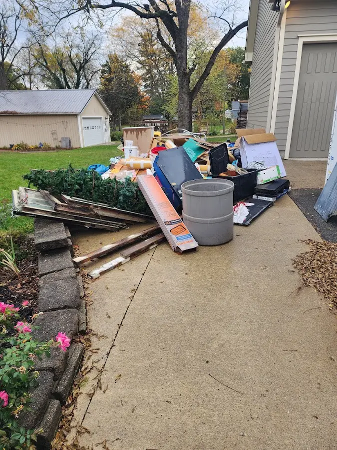 Dumpster being loaded with debris for Estate Cleanout Dumpster Rental in Huntingdon